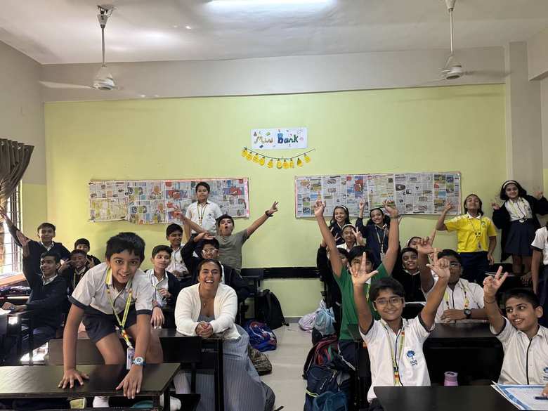 Students at GGIS raising their hands during an in-class activity